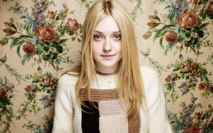 Dakota Fanning, American actress and celebrity, poses gracefully against a floral backdrop, showcasing her distinctive style in this HD desktop wallpaper.
