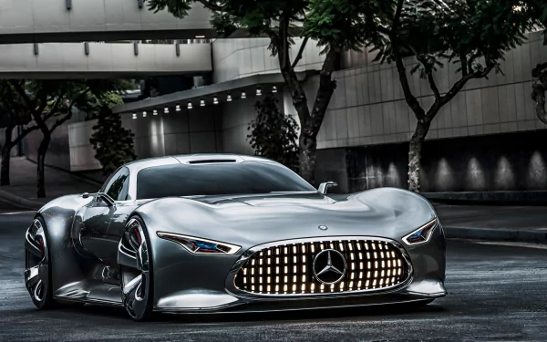 Sleek silver Mercedes-Benz AMG Vision Gran Turismo showcased in an urban setting, captured in a high-definition PC desktop wallpaper.