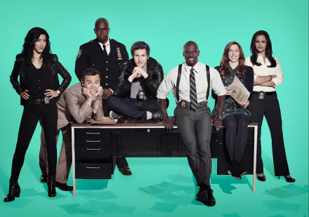 HD desktop wallpaper of 'Brooklyn Nine-Nine' cast posing against a teal background.