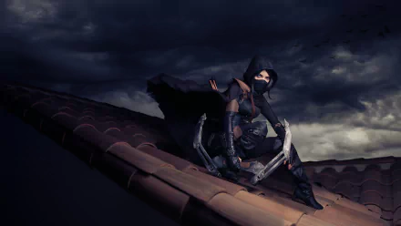 A woman in a mask and cloak sits on a rooftop, wielding a bow, inspired by the Thief video game. The dark, moody background enhances the stealthy atmosphere of the cosplay.
