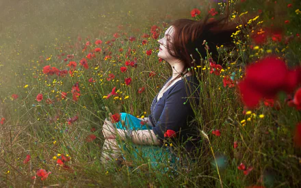 HD desktop wallpaper featuring a woman enjoying a serene moment in a vibrant meadow filled with wildflowers, capturing a tranquil mood.