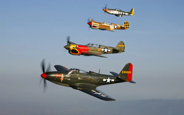 HD desktop wallpaper showing North American P-51 Mustang and Curtiss P-40 Warhawk military aircraft flying in formation against a clear blue sky.