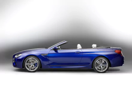 Blue BMW M6 Convertible vehicle, side view on a soft gradient — HD PC desktop wallpaper and background.