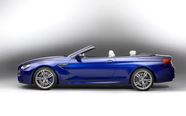 Blue BMW M6 Convertible vehicle, side view on a soft gradient — HD PC desktop wallpaper and background.