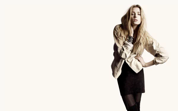 HD PC desktop wallpaper featuring French model Sigrid Agren posing confidently against a plain background, showcasing her stylish outfit and natural look.