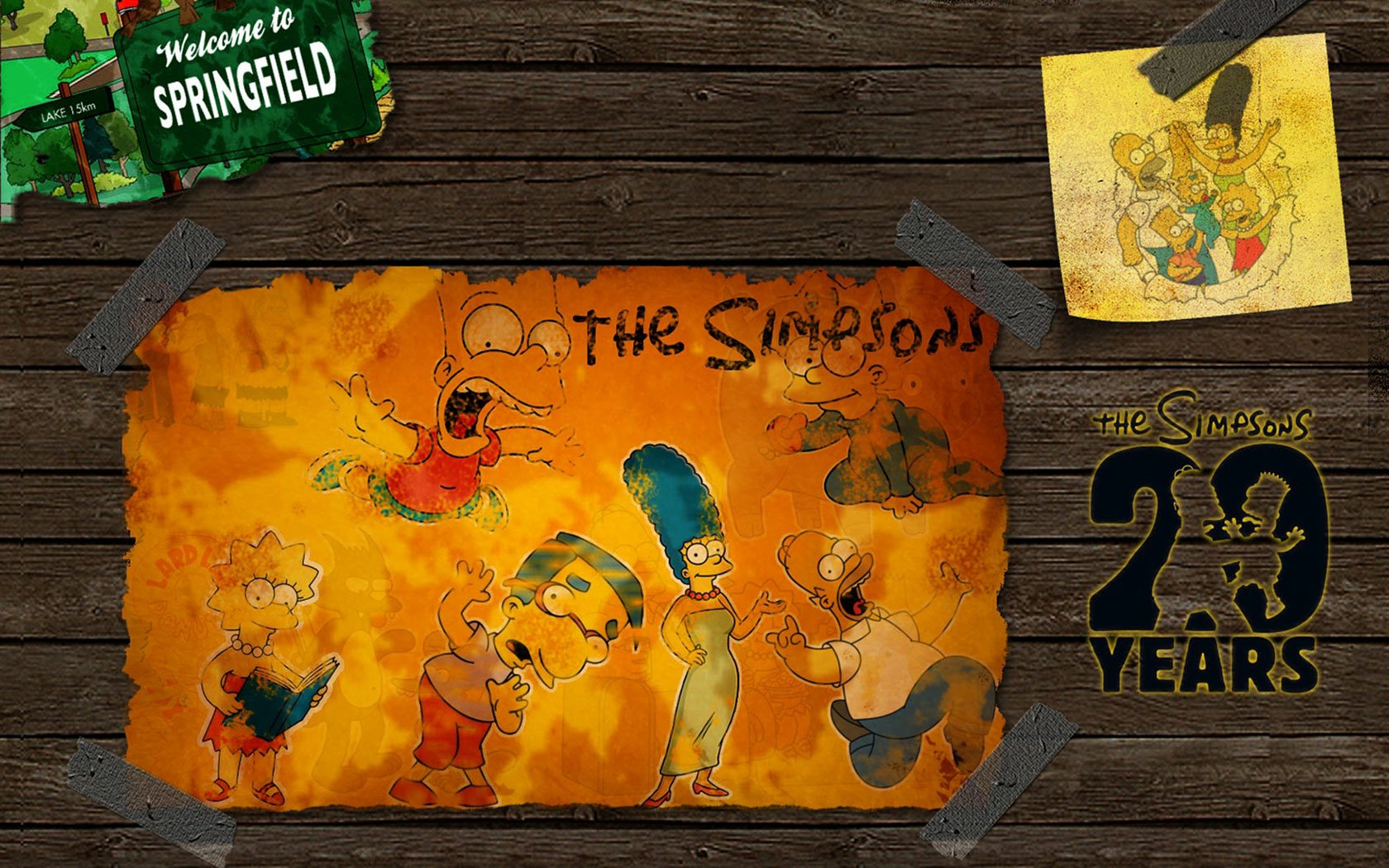 HD PC desktop wallpaper featuring The Simpsons characters with a rustic Springfield sign and a tribute to 30 years of the TV show.