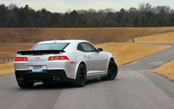 White Chevrolet Camaro Z28 driving on a winding road, captured in sharp detail as an HD PC desktop wallpaper and background.