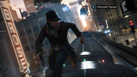 Aiden Pearce from the video game Watch Dogs is depicted running on top of a train, with a city skyline in the background and a helicopter labeled “Helicopter Hacked” overhead.