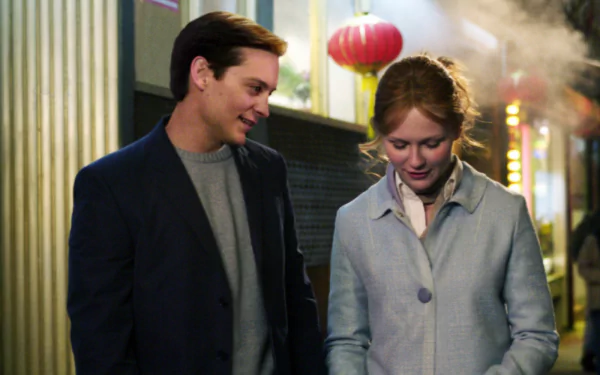 HD desktop wallpaper featuring Tobey Maguire and Kirsten Dunst from the Spider-Man 2 movie, capturing a candid moment between the characters.