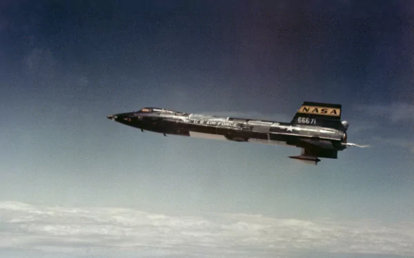 HD desktop wallpaper featuring the North American X-15 military rocket-powered aircraft soaring above the clouds against a clear sky background.