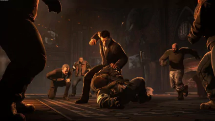 HD PC desktop wallpaper from the video game Batman: Arkham Origins: a suited man pins a fallen figure as armed thugs close in inside a dim, industrial warehouse.