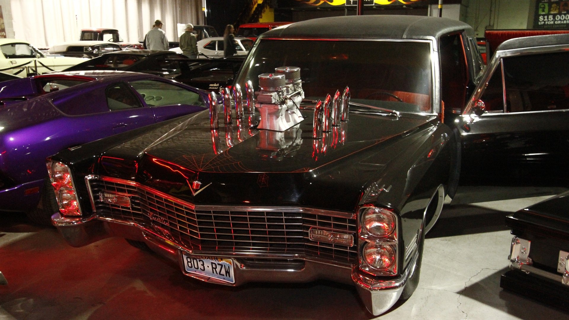 4K Ultra HD desktop wallpaper featuring a classic black car from the TV show Counting Cars, showcased in a garage setting with vibrant lighting.