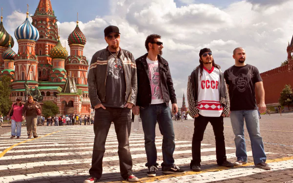 HD desktop wallpaper featuring System Of A Down standing in front of Saint Basil's Cathedral in Moscow.