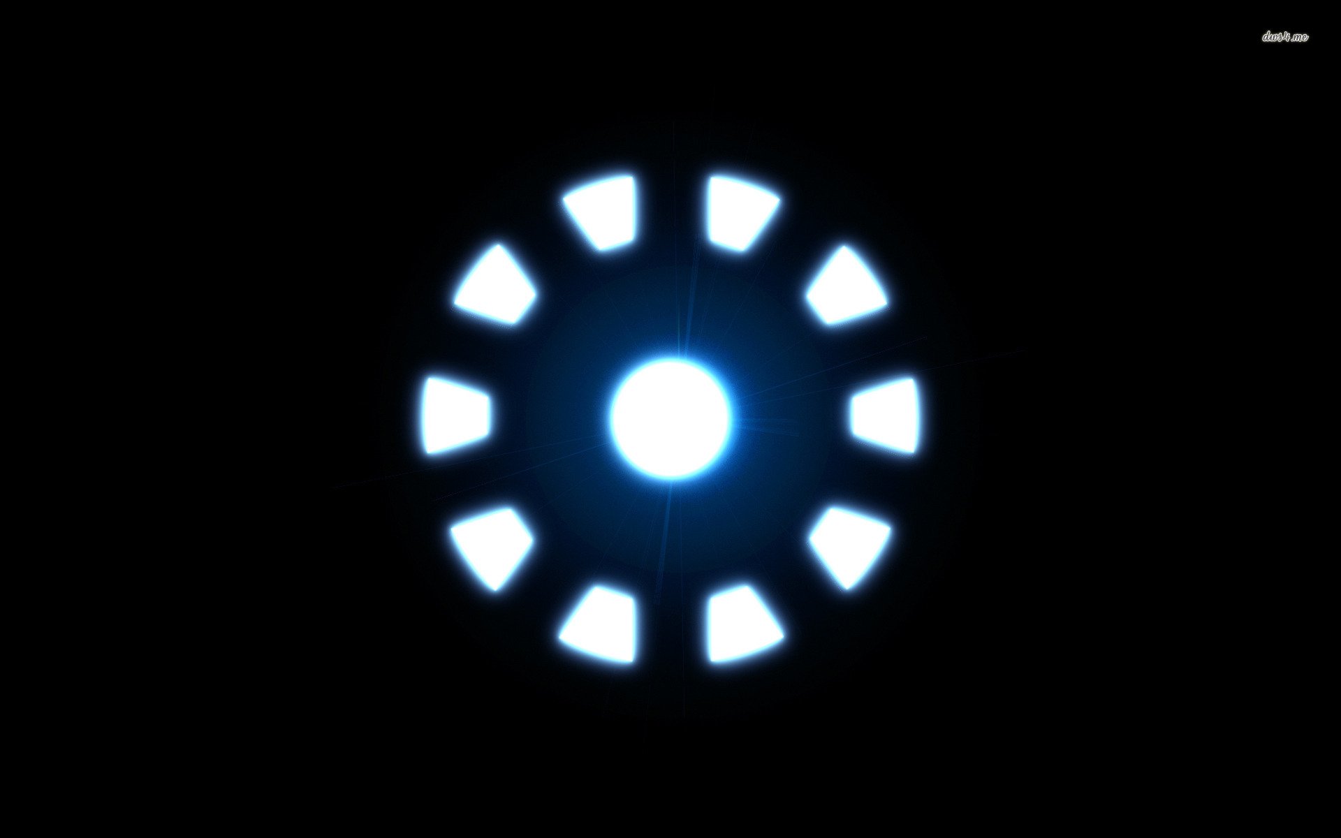 HD desktop wallpaper featuring the glowing arc reactor from the movie Iron Man against a black background.
