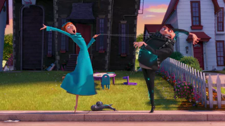 HD PC desktop wallpaper featuring Lucy and Gru from the movie Despicable Me 2 striking playful poses outside a suburban house at sunset.