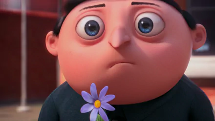 HD desktop wallpaper featuring Gru from the movie Despicable Me 2 holding a small purple flower with a thoughtful expression.