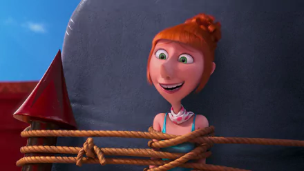 HD desktop wallpaper featuring Lucy from the movie Despicable Me 2, showing her smiling with red hair against a bright blue sky background.