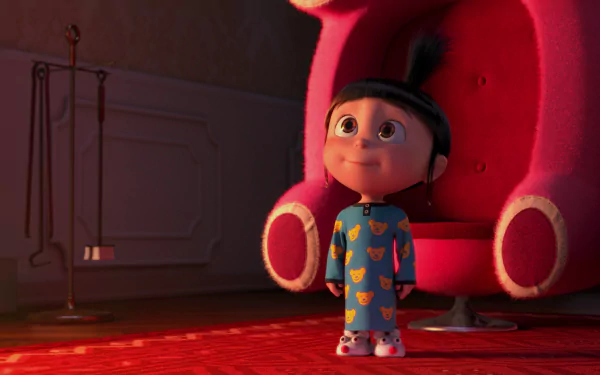 Agnes from Despicable Me stands in a cozy room, gazing up with wonder. The image captures her playful spirit, showcasing a scene from Despicable Me 2 in vibrant HD quality.