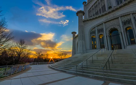 Baha'i Temple at sunset — religious stone temple with sweeping steps, ornate facade and glowing sky; HD PC desktop wallpaper background.