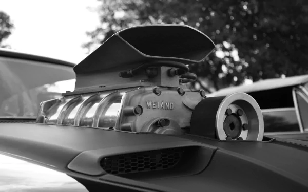4K Ultra HD black and white Mad Max movie desktop wallpaper showcasing a close-up of a powerful engine blower on a muscle car.