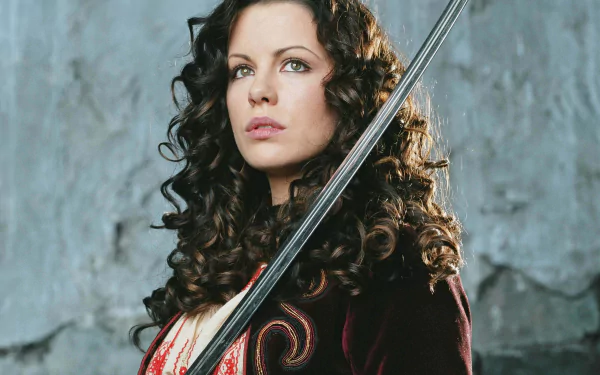 A striking HD wallpaper featuring Kate Beckinsale as she appears in Van Helsing, showcasing her fierce expression and elegant attire, sword in hand against a textured backdrop.
