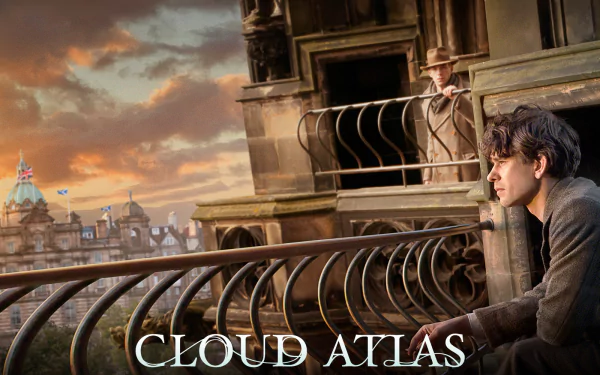 HD PC desktop wallpaper from the movie Cloud Atlas — a contemplative figure on a balcony overlooking a city at sunset with ornate railings and the film title.