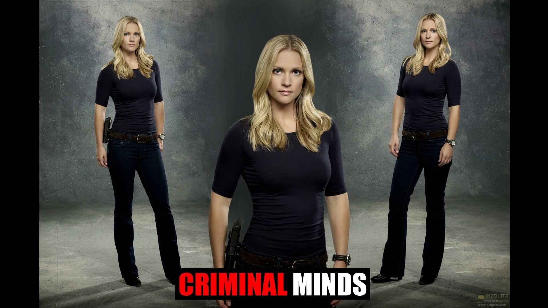 HD desktop wallpaper featuring a character from the TV show Criminal Minds, standing confidently in a dark top and jeans against a textured background.