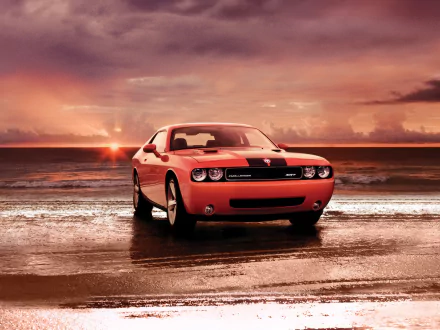 A red Dodge Challenger SRT8 parked on a wet beach at sunset, captured in an HD PC desktop wallpaper background.