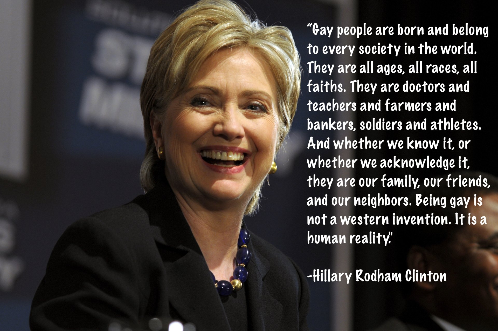 HD desktop wallpaper featuring a quote on inclusivity by Hillary Rodham Clinton, with her smiling portrait in the background.