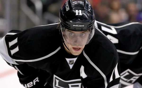 HD desktop wallpaper featuring a focused Los Angeles Kings hockey player on the ice, clad in team colors.
