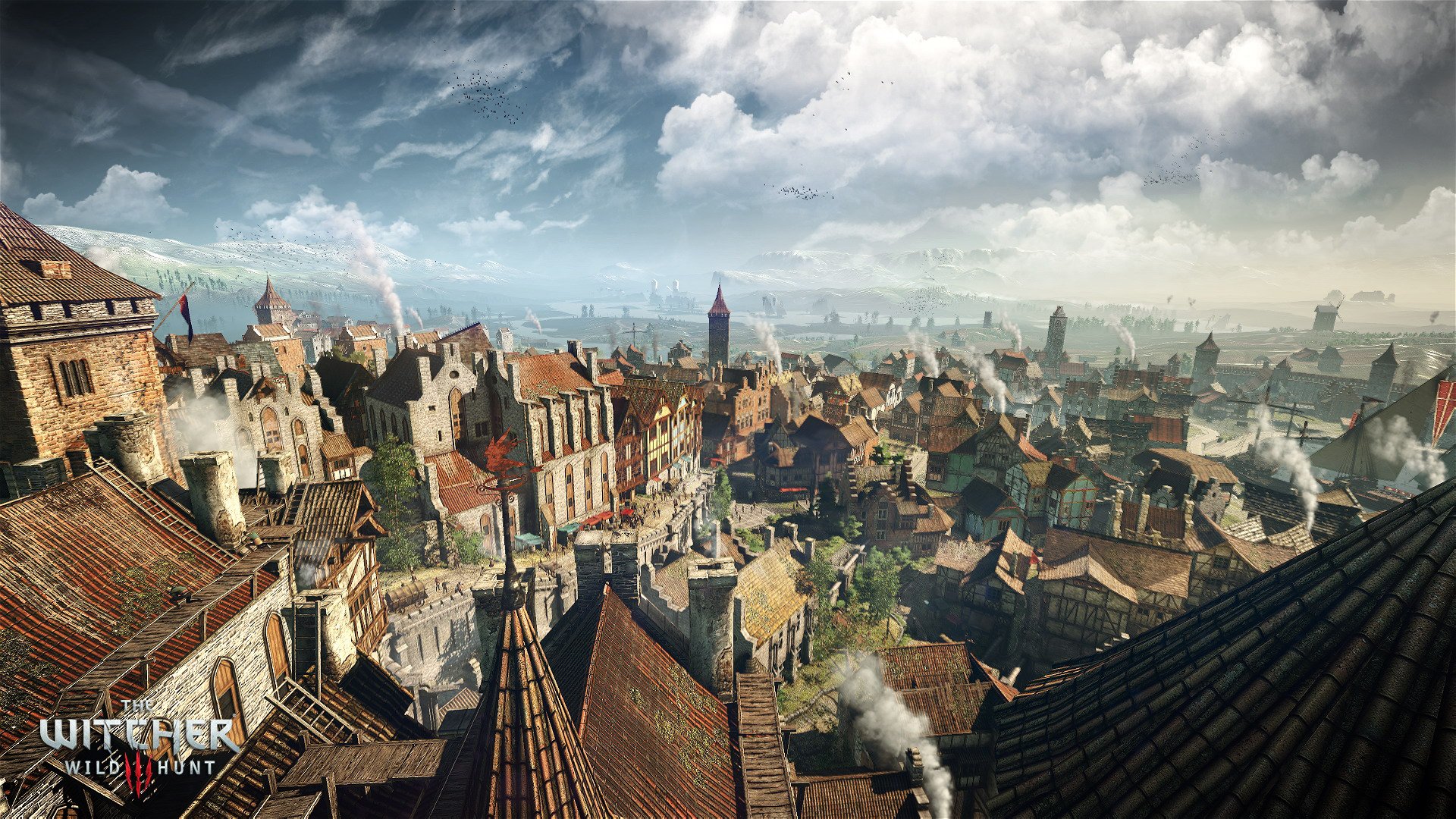 A stunning HD desktop wallpaper from The Witcher 3: Wild Hunt, featuring a detailed cityscape with rustic rooftops, smoke rising, and a dramatic sky above.