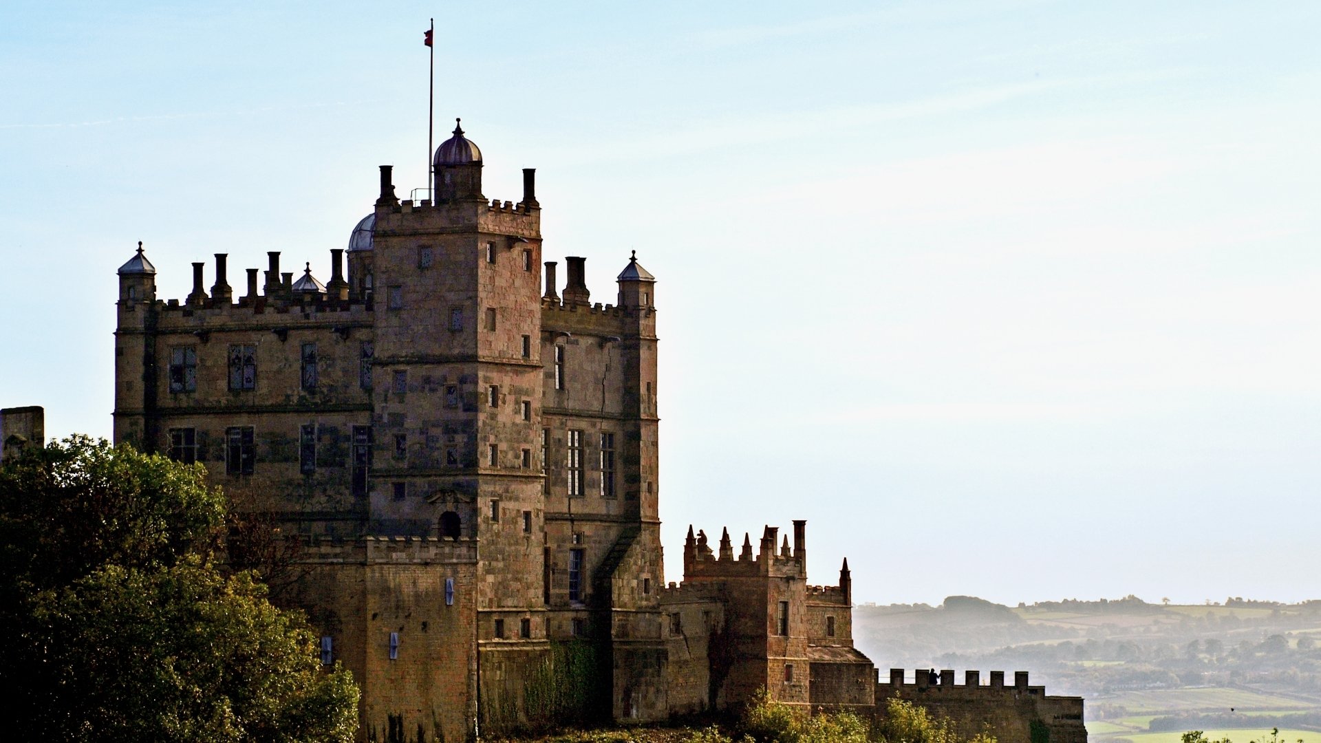 HD desktop wallpaper showcasing the man-made Bolsover Castle against a clear sky with distant landscape views.