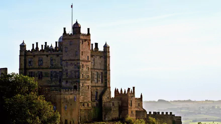 HD desktop wallpaper showcasing the man-made Bolsover Castle against a clear sky with distant landscape views.