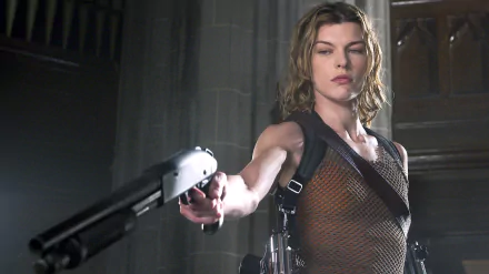 Milla Jovovich in an intense scene from Resident Evil: Apocalypse, wielding a shotgun in a dramatic setting, featured as an HD PC desktop wallpaper and background.