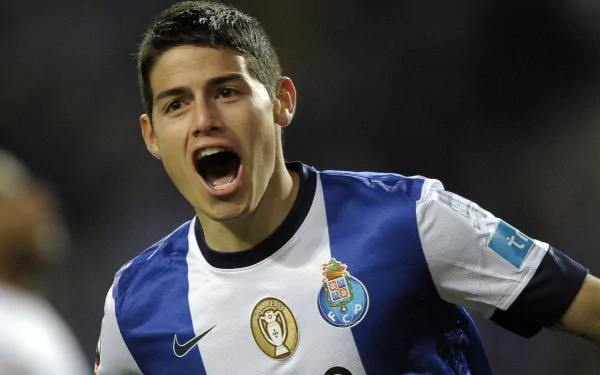 HD desktop wallpaper featuring James Rodriguez in an FC Porto jersey celebrating during a game.
