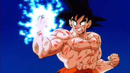 HD PC desktop wallpaper featuring Goku from the Dragon Ball Z: Ultime Menace video game, showcasing his intense energy aura and battle-worn appearance.