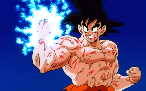 HD PC desktop wallpaper featuring Goku from the Dragon Ball Z: Ultime Menace video game, showcasing his intense energy aura and battle-worn appearance.
