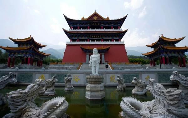 HD desktop wallpaper of a Chinese religious temple featuring traditional architecture, a central statue, and dragon sculptures surrounding a reflective pool.