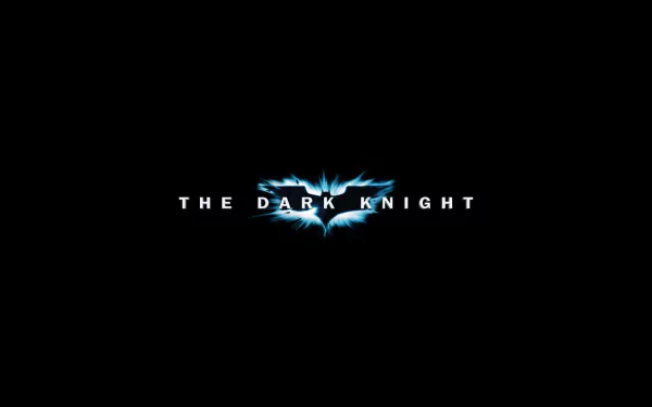 HD PC desktop wallpaper featuring the logo of the movie The Dark Knight, with a sleek black background and glowing blue bat symbol.