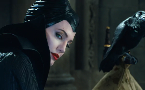 Angelina Jolie as Maleficent gazes intensely, her striking features highlighted against a dark background, accompanied by a raven, creating a captivating and mystical atmosphere.