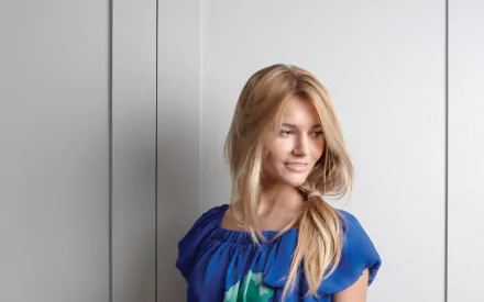 French model Nadege Dabrowski wearing a blue top, posing against a minimalist light gray background, featured in an HD PC desktop wallpaper.