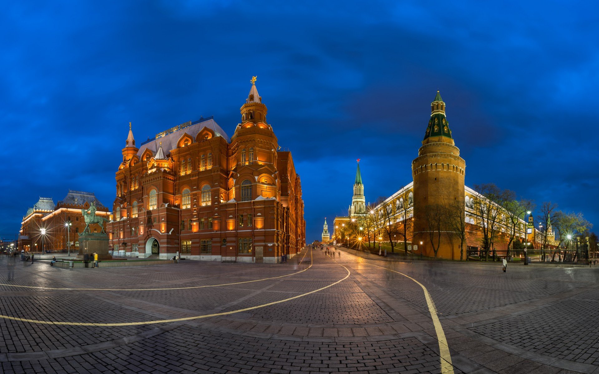 HD desktop wallpaper showcasing a beautifully illuminated man-made palace at dusk, set against a deep blue sky.