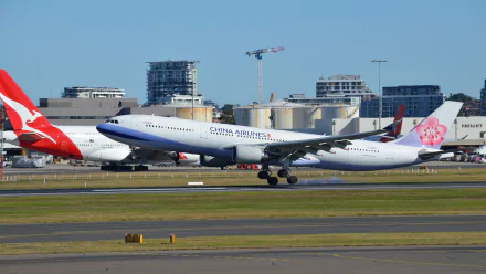 A China Airways Airbus A330 takes off at Sydney Airport, showcasing the aircraft against a clear blue sky and modern cityscape in the background.