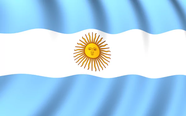 A vibrant HD wallpaper featuring the flag of Argentina, showcasing the iconic blue and white stripes with the sun emblem at its center, creating a dynamic background.