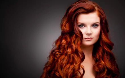 HD desktop wallpaper featuring a woman named Karoline Kate with voluminous, wavy red hair against a dark background.