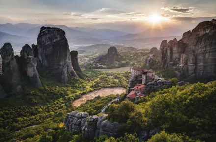 A stunning aerial view of Meteora's monasteries perched atop towering rock formations, surrounded by lush greenery and bathed in soft sunrise light, showcasing Greece's rich religious heritage.