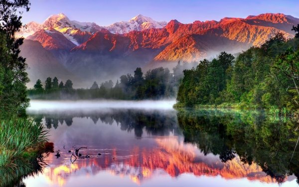 Tierra/Naturaleza Aoraki/Mount Cook Montañas Sunlight Reflejo Nueva Zelanda South Island Mount Cook Southern Alps Lake Matheson Fondo de pantalla HD | Fondo de Escritorio