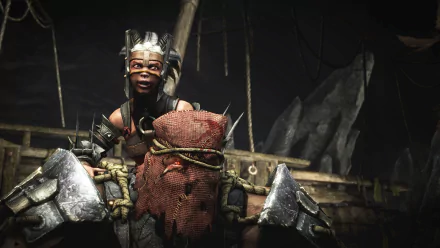 A character from Mortal Kombat X poses triumphantly, showcasing intense detail and dynamic lighting in this HD PC desktop wallpaper and background.