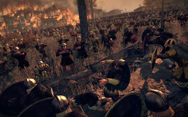 HD PC desktop wallpaper from the video game Total War: Attila, depicting intense battlefield combat with soldiers clashing amid fire and chaos.