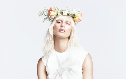 HD desktop wallpaper featuring Czech model and celebrity Karolína Kurková wearing a white outfit and a floral crown against a clean white background.
